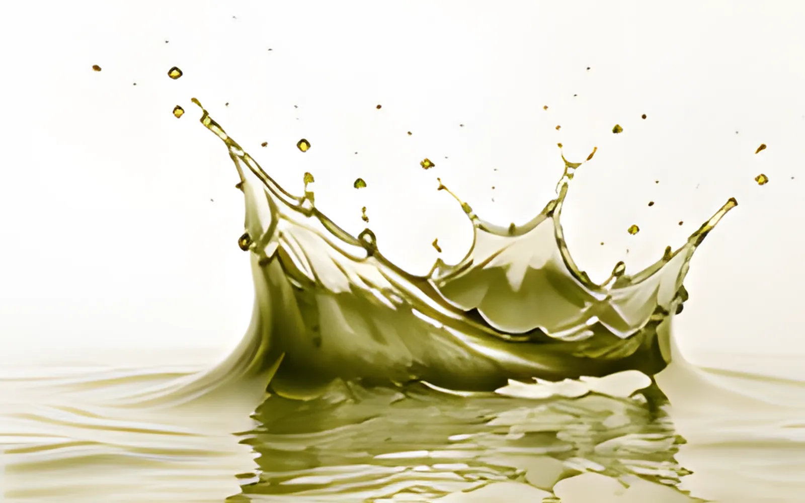 Olive green liquid splash representing UKCP liquid admixtures